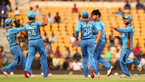 Afganistan's Hamid Hasan (2R) celebrates the wicket of Zimbabwe captain Hamilton Masakadza during the T20 World Cup cricket match between Zimbabwe and Afghanistan at the VCA stadium in Nagpur on March 12, 2016. / AFP / Prashant Bhoot (Photo credit should read PRASHANT BHOOT/AFP/Getty Images)